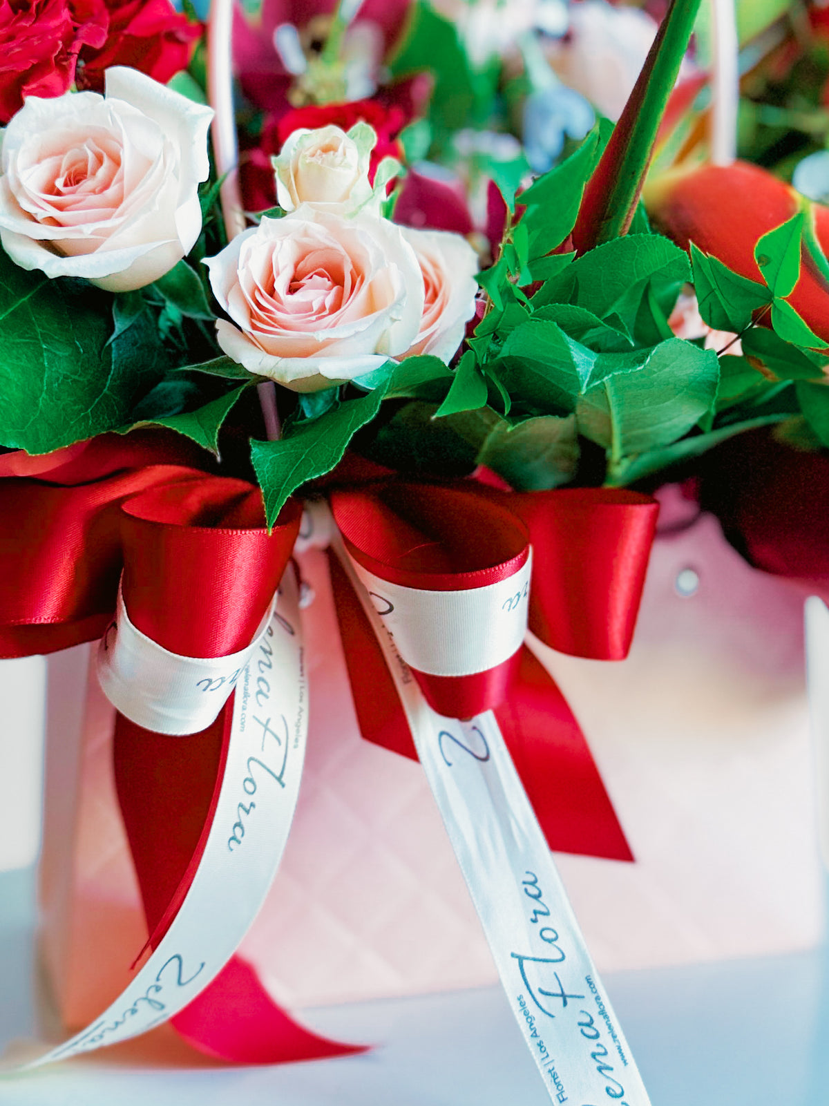 Pink spray roses and Zelena Flora ribbon detail in Rosy Runway