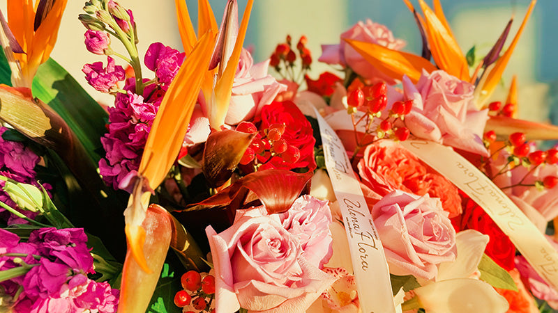 Luxury fall floral arrangement with roses, hydrangea, orchids and tropical accents