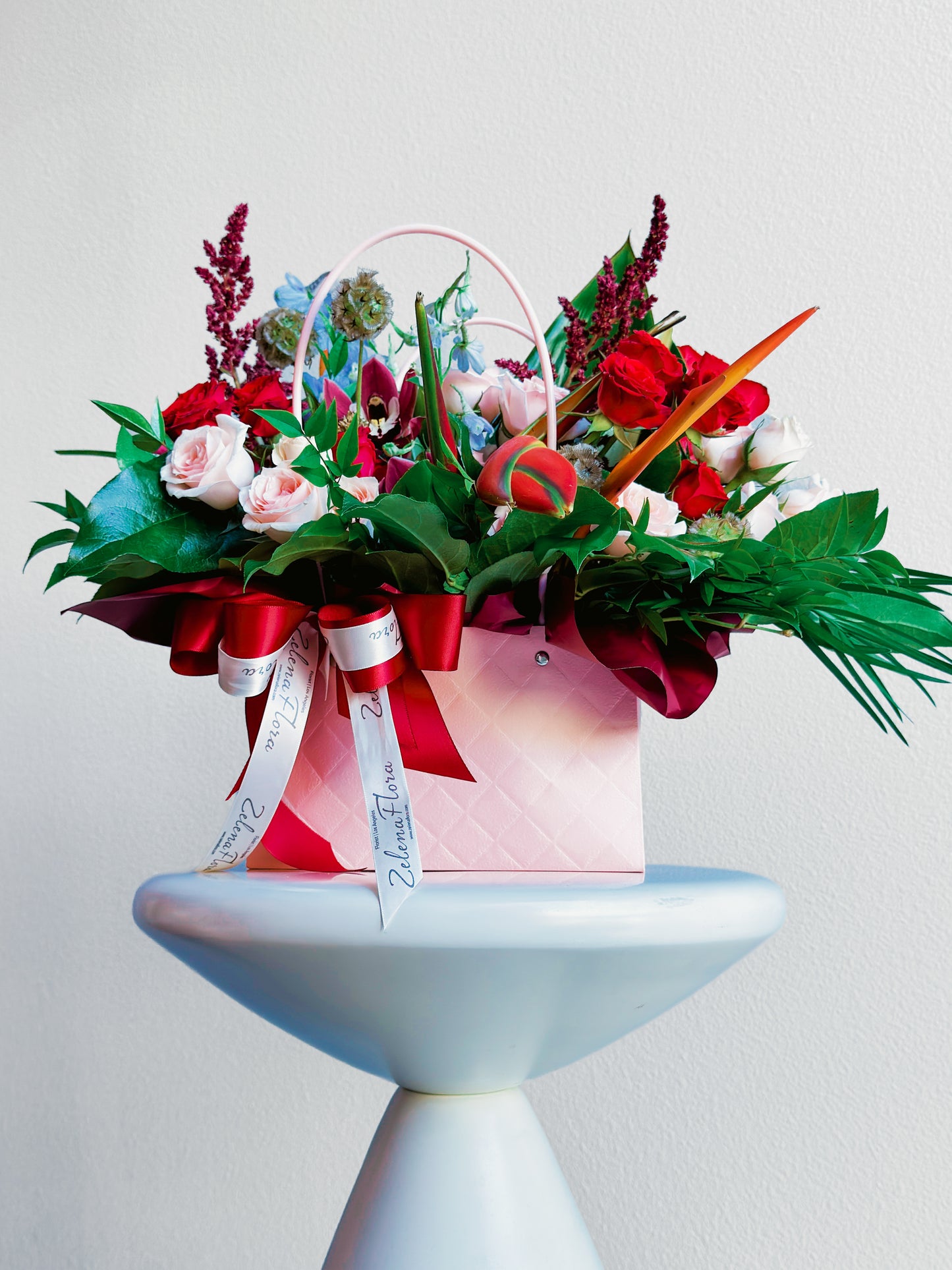 Full view of Rosy Runway handbag flower arrangement by Zelena Flora
